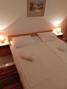Postel nebo postele na pokoji v ubytování Apartments Verica