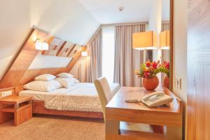 Postel nebo postele na pokoji v ubytování Hotel Zbójnicówka