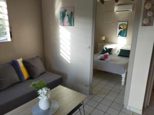 Postel nebo postele na pokoji v ubytování Ti Village Creole