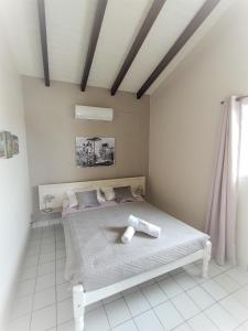 Postel nebo postele na pokoji v ubytování Ti Village Creole