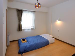 Postel nebo postele na pokoji v ubytování Kumagaya Royal Hotel Suzuki