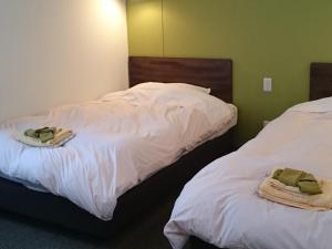 Postel nebo postele na pokoji v ubytování Kumagaya Royal Hotel Suzuki