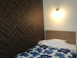 Postel nebo postele na pokoji v ubytování Kumagaya Royal Hotel Suzuki