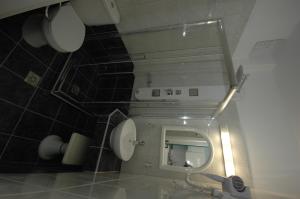 a bathroom with a toilet and a mirror in it at Hotel Anixis Resort in Naxos Chora +25 photos