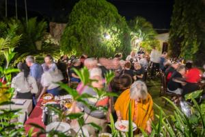 a crowd of people at a party in a garden at Imperial Heights Hotel, Entebbe in Entebbe
