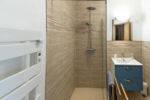 a bathroom with a shower and a sink at le chalet in Airaines