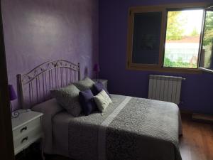 A bed or beds in a room at A PORTELA - Pereiro de Aguiar