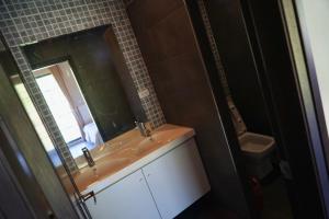 a bathroom with a sink and a mirror at Two Fish Homestay in Lanyu