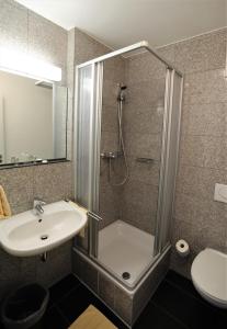 a bathroom with a shower and a sink at Hotel Christl München Innenstadt in Munich