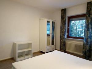 Ein Bett oder Betten in einem Zimmer der Unterkunft Ferienwohnung Brenderweg
