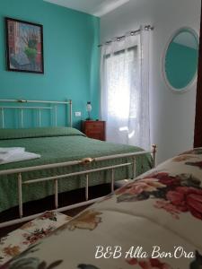 Een bed of bedden in een kamer bij B&B Alla Bon'ora