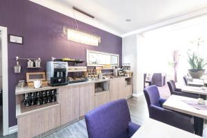 Kuchyň nebo kuchyňský kout v ubytování Hotel Porta Nigra