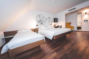 Cama ou camas em um quarto em Hotel Bernina Geneva