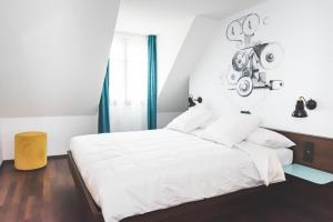 Cama ou camas em um quarto em Hotel Bernina Geneva