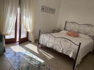 Postel nebo postele na pokoji v ubytování B&B Il Vicolo