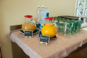two pitchers of orange juice on a table at Park Hotel Abbadia in Abbadia Lariana