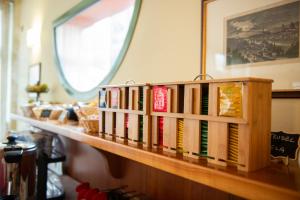 a row of books sitting on a shelf at Park Hotel Abbadia in Abbadia Lariana