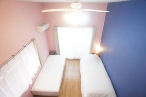 Letto o letti in una camera di Plusone Nishikoen