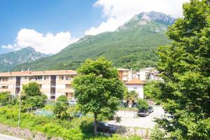a view of a town with mountains in the background at Park Hotel Abbadia in Abbadia Lariana