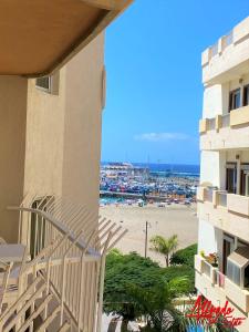 a view of the beach from a balcony of a building at Edificio Playa in Los Cristianos