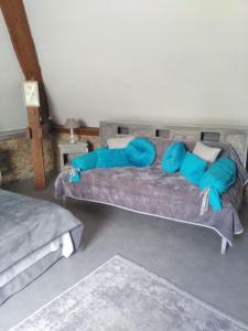מיטה או מיטות בחדר ב-Le Rumain