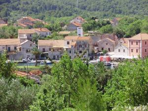 a small town with a bunch of houses and trees at Villa Welcome in Vrboska