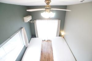 Letto o letti in una camera di Plusone Nishikoen