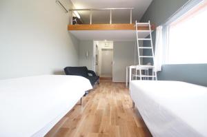 Letto o letti in una camera di Plusone Nishikoen