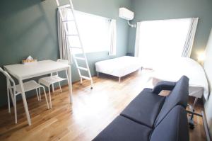 Letto o letti in una camera di Plusone Nishikoen