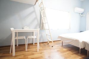 Letto o letti in una camera di Plusone Nishikoen