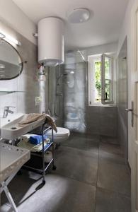 a bathroom with a shower and a sink at City Appartement in Bad Radkersburg