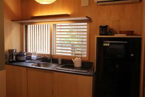Kuchyň nebo kuchyňský kout v ubytování Enso-an House