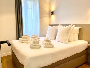 Ένα ή περισσότερα κρεβάτια σε δωμάτιο στο Maxim - Easy Home Booking