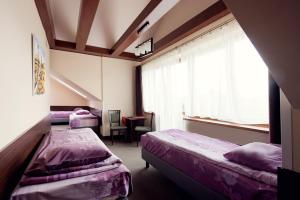 Posteľ alebo postele v izbe v ubytovaní Willa Czarownica