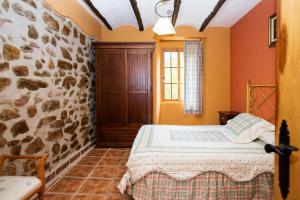Posteľ alebo postele v izbe v ubytovaní Apartamentos Casa Rural La Pandera