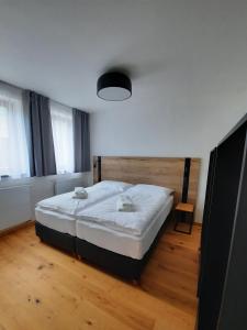 Postel nebo postele na pokoji v ubytování Apartmány Resort Na Horské