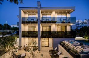a large white building with a pool in front of it at Luxury Apartments in Villa Curiera in Malinska