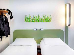 Postel nebo postele na pokoji v ubytování Hotel Ibis Budget Vichy