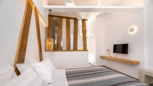 Postel nebo postele na pokoji v ubytování Santorini View