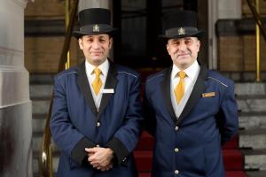 two men in military uniforms standing next to each other at InterContinental Amstel Amsterdam, an IHG Hotel in Amsterdam