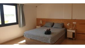A bed or beds in a room at Joiebre
