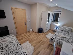 Postel nebo postele na pokoji v ubytování Apartman Božur ****