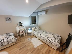 Postel nebo postele na pokoji v ubytování Apartman Božur ****