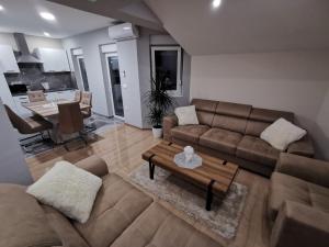 Posezení v ubytování Apartman Božur ****