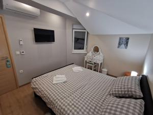 Postel nebo postele na pokoji v ubytování Apartman Božur ****