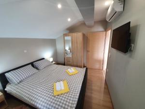 Postel nebo postele na pokoji v ubytování Apartman Božur ****