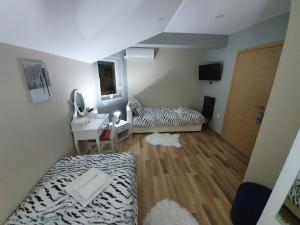 Postel nebo postele na pokoji v ubytování Apartman Božur ****