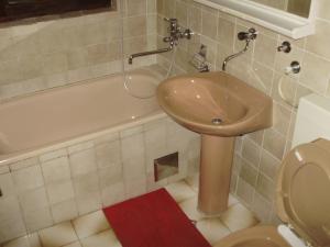 a bathroom with a sink and a toilet and a tub at Villa Welcome in Vrboska +37 photos
