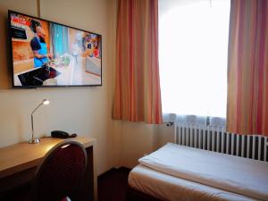 TV a/nebo společenská místnost v ubytování Hotel Scholz