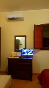 TV a/nebo společenská místnost v ubytování Green Park Hotel & Residence